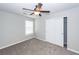 This bedroom boasts neutral paint and carpet and a ceiling fan with lighting and closet at 107 Brookhaven Rd, Summerville, SC 29486
