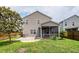 The exterior of a home featuring a well-maintained yard and a screened-in porch at 107 Brookhaven Rd, Summerville, SC 29486