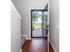 Inviting front entrance featuring wood flooring and a storm door, providing a glimpse of the neighborhood beyond at 107 Brookhaven Rd, Summerville, SC 29486