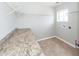 Well-lit laundry room with a window, overhead lighting and shelving, and a countertop workspace at 107 Brookhaven Rd, Summerville, SC 29486
