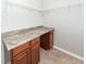 Laundry room features a countertop workspace, base cabinets, and overhead shelving at 107 Brookhaven Rd, Summerville, SC 29486