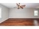 Bright and airy living area with wood floors, a ceiling fan, and natural light from multiple windows at 107 Brookhaven Rd, Summerville, SC 29486
