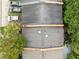 Aerial view of roof of home, with trees, driveway and cars on the side at 11 America St, Charleston, SC 29403