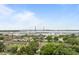 Beautiful aerial view of the city with lush green trees and a bridge in the distance at 11 America St, Charleston, SC 29403