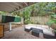 Inviting back patio area with an outdoor seating and a mounted television at 11 America St, Charleston, SC 29403