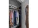 Organized closet space with hanging clothes, shelf storage, and a variety of attire at 11 America St, Charleston, SC 29403