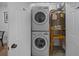 Space-saving laundry closet with stacked washer/dryer and an energy-efficient water heater at 11 America St, Charleston, SC 29403
