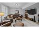 Spacious living room with ample seating, a large TV, and stylish decor at 11 America St, Charleston, SC 29403