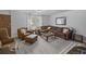Cozy living room boasts comfortable seating, a stylish rug, and ample natural light at 11 America St, Charleston, SC 29403