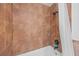 Bathroom featuring a shower/tub combo with brown tile and black shower head at 11 America St, Charleston, SC 29403