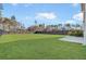 Expansive backyard features a large green lawn, privacy fence, and lush landscaping, creating a serene outdoor space at 110 Cardinal Flower Ct, Moncks Corner, SC 29461