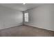 Bedroom features neutral carpet, a window with blinds, and neutral colored walls at 110 Cardinal Flower Ct, Moncks Corner, SC 29461