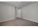 Neutral-toned bedroom with carpeting and a door that opens to another room at 110 Cardinal Flower Ct, Moncks Corner, SC 29461