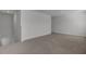 Neutral-toned, carpeted bonus room with ample space and natural light at 110 Cardinal Flower Ct, Moncks Corner, SC 29461