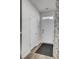 Bright hallway featuring tile flooring and white interior doors at 110 Cardinal Flower Ct, Moncks Corner, SC 29461