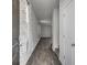 Inviting hallway showcasing hardwood flooring and decorative curtains at 110 Cardinal Flower Ct, Moncks Corner, SC 29461