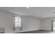 Bright living room with luxury vinyl plank flooring and large window at 110 Cardinal Flower Ct, Moncks Corner, SC 29461