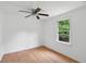 Bright bedroom with hardwood floors, ceiling fan and a window with natural light at 1121 Armstrong Ave, Charleston, SC 29407