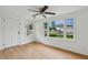 Bright bedroom with large windows, ceiling fan and wood floors at 1121 Armstrong Ave, Charleston, SC 29407