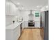 Modern kitchen with white cabinetry, stainless steel appliances, and sleek countertops at 1121 Armstrong Ave, Charleston, SC 29407