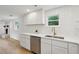 Stylish kitchen with white cabinetry, stainless steel appliances, and sleek countertops at 1121 Armstrong Ave, Charleston, SC 29407