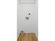Empty laundry room with hardwood floors and washer/dryer hookups at 1121 Armstrong Ave, Charleston, SC 29407