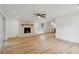 Bright living room featuring a decorative fireplace, ceiling fan, and wood-look floors at 1121 Armstrong Ave, Charleston, SC 29407