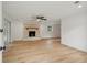 Bright living room featuring a decorative fireplace, ceiling fan, and wood-look floors at 1121 Armstrong Ave, Charleston, SC 29407