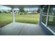 Covered back patio with a large green backyard view and ample space to sit and relax at 118 Magnolia House Dr, Summerville, SC 29486