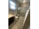 Modern bathroom with a walk-in shower and bench, creating a spa-like experience at 118 Magnolia House Dr, Summerville, SC 29486