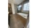 Elegant bathroom with a soaking tub, walk-in shower, and window for natural light, creating a peaceful retreat at 118 Magnolia House Dr, Summerville, SC 29486