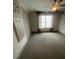 Spacious bedroom featuring neutral carpet, natural light, and ceiling fan at 118 Magnolia House Dr, Summerville, SC 29486