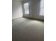 Bright bedroom with neutral carpet and dual windows at 118 Magnolia House Dr, Summerville, SC 29486