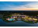 Aerial view of a vibrant community featuring lakes, a pool, and lush landscaping at 118 Magnolia House Dr, Summerville, SC 29486