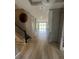 Inviting hallway with wood floors, stairs, and views of the backyard, creating a seamless transition to the outdoors at 118 Magnolia House Dr, Summerville, SC 29486