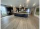 Modern kitchen with a large island, stainless steel appliances, and dark cabinetry for a sleek and functional design at 118 Magnolia House Dr, Summerville, SC 29486