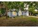 Charming single-story home with manicured lawn, flower beds, and an attached two-car garage at 1309 Llewellyn Rd, Mount Pleasant, SC 29464