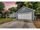 Charming home with a large garage, lush landscaping, and a well-maintained lawn at sunset at 1309 Llewellyn Rd, Mount Pleasant, SC 29464