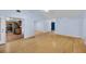 Bright, open-concept living room features wood floors that leads into an adjacent kitchen at 1309 Llewellyn Rd, Mount Pleasant, SC 29464