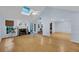 Bright living room with hardwood floors, a fireplace, and a vaulted ceiling with a skylight at 1309 Llewellyn Rd, Mount Pleasant, SC 29464