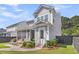 Backyard showcasing the screened porch and a lush, landscaped yard at 1392 Founders Way, Mount Pleasant, SC 29464