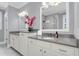 Bright bathroom with double sinks, quartz countertops, and modern fixtures, providing a clean and contemporary look at 1392 Founders Way, Mount Pleasant, SC 29464