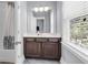 Well-lit bathroom featuring a vanity with drawers and an adjacent tub/shower at 1392 Founders Way, Mount Pleasant, SC 29464