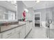 Elegant bathroom with double vanity, marble tile, and a glass-enclosed shower, creating a spa-like atmosphere at 1392 Founders Way, Mount Pleasant, SC 29464