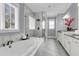 Luxurious bathroom featuring a soaking tub and glass-enclosed shower at 1392 Founders Way, Mount Pleasant, SC 29464