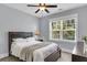 Cozy bedroom featuring a ceiling fan, natural light from a window, and neutral tones for a relaxing ambiance at 1392 Founders Way, Mount Pleasant, SC 29464