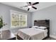 Cozy bedroom featuring a wooden headboard and a well-lit window at 1392 Founders Way, Mount Pleasant, SC 29464