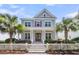 Charming two-story home with a white picket fence and tropical landscaping at 1392 Founders Way, Mount Pleasant, SC 29464