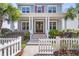Beautifully landscaped home with a welcoming front porch and white picket fence at 1392 Founders Way, Mount Pleasant, SC 29464