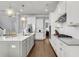 Modern kitchen with a central island, stainless steel appliances, and custom cabinetry at 1392 Founders Way, Mount Pleasant, SC 29464